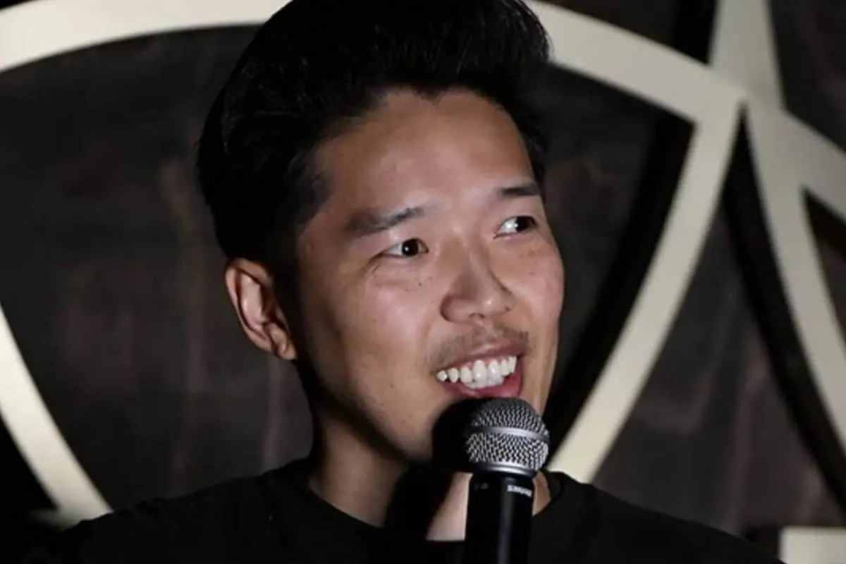 Alex Duong, Blue Bloods actor and comedian, with a warm, engaging smile.