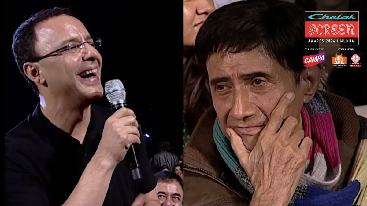 Vidhu Vinod Chopra speaking intensely at Screen Awards stage.