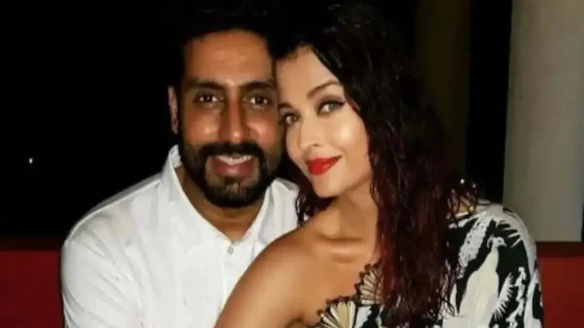 Abhishek Bachchan and Aishwarya Rai Bachchan smiling together at an event.