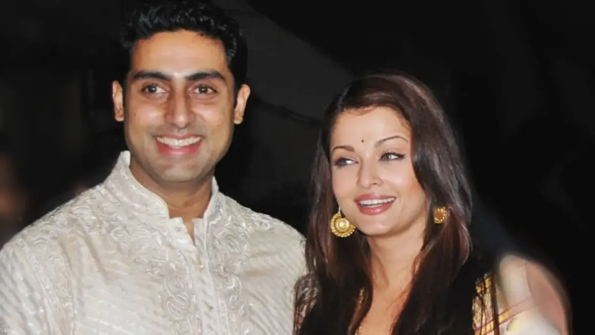 Abhishek Bachchan and Aishwarya Rai Bachchan posing together elegantly.