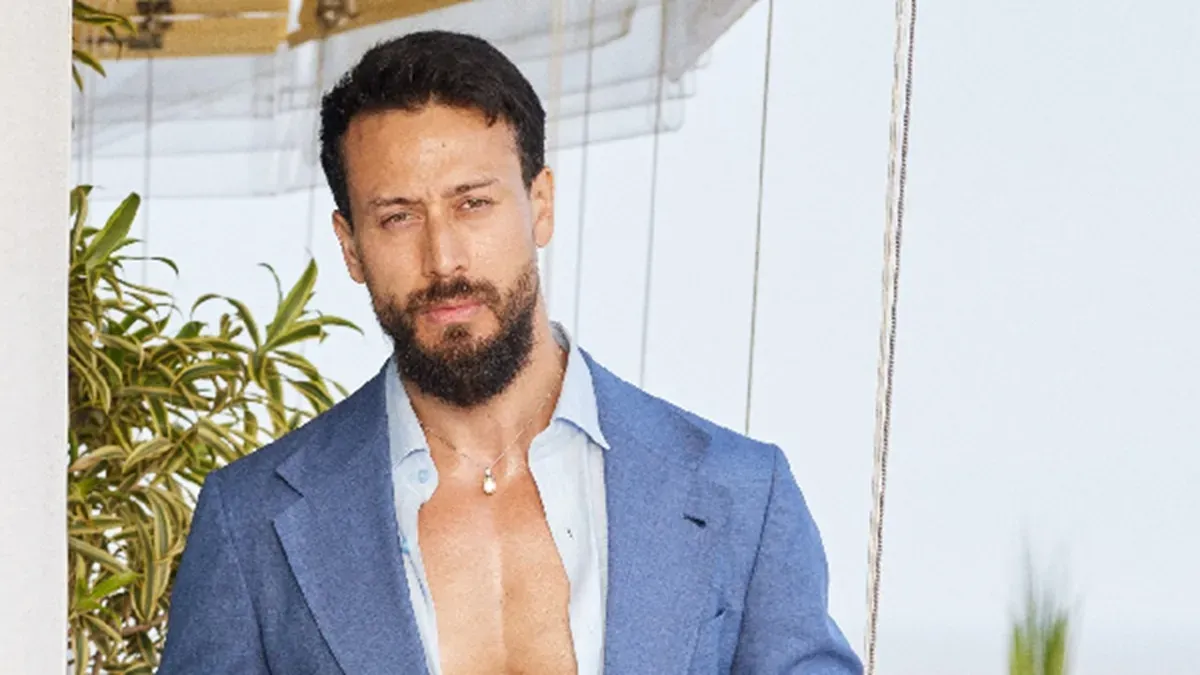 Tiger Shroff striking a dynamic pose in a silhouette, reminiscent of Michael Jackson.