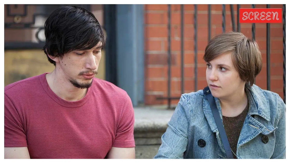 Adam Driver looking serious and intense at a red carpet event