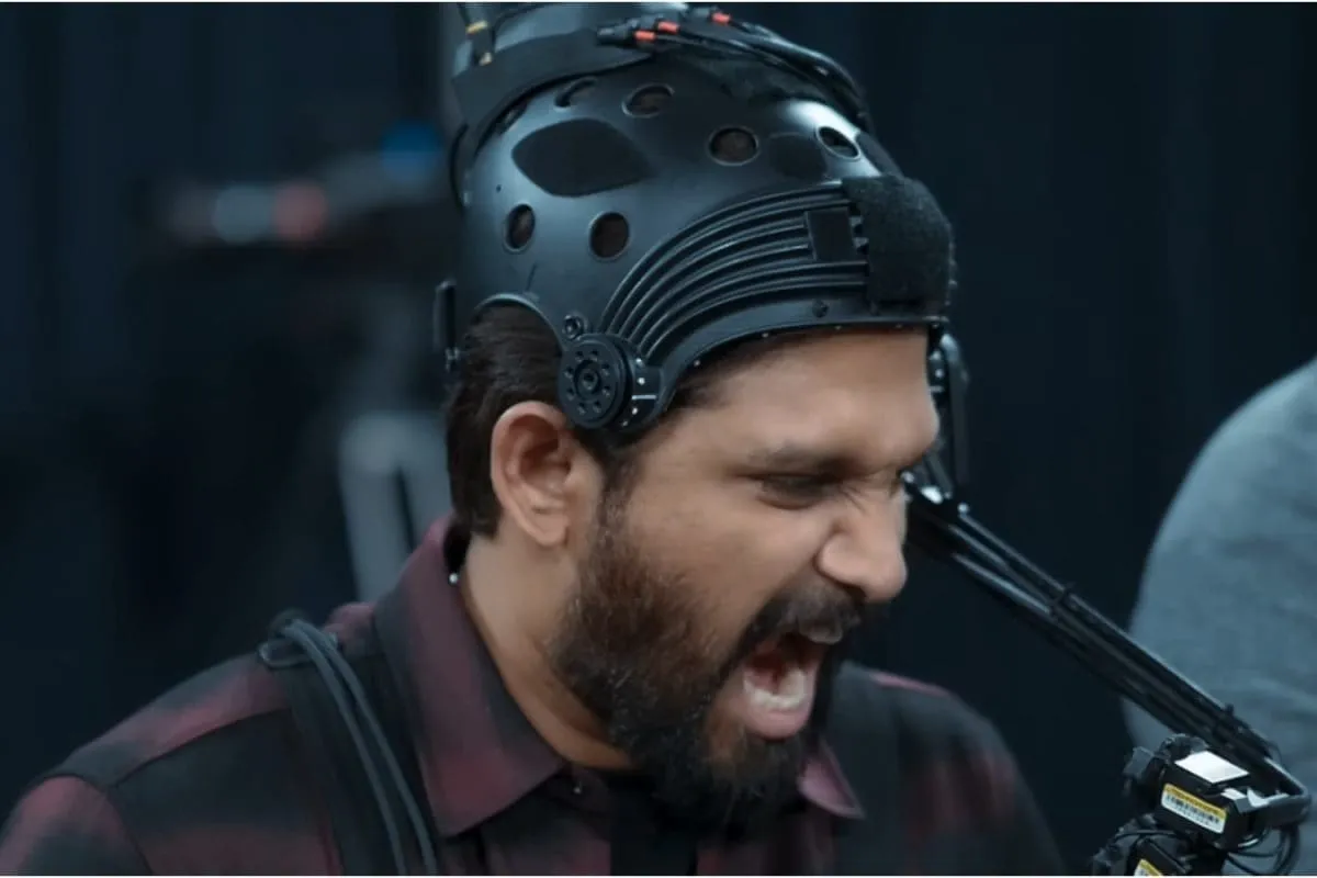 Allu Arjun smiling and looking focused, perhaps against a vibrant film set background.