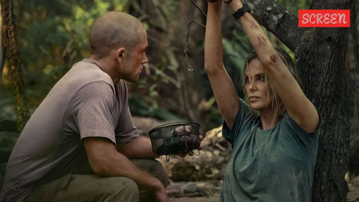 Charlize Theron looking determined in a scene from the movie Apex.