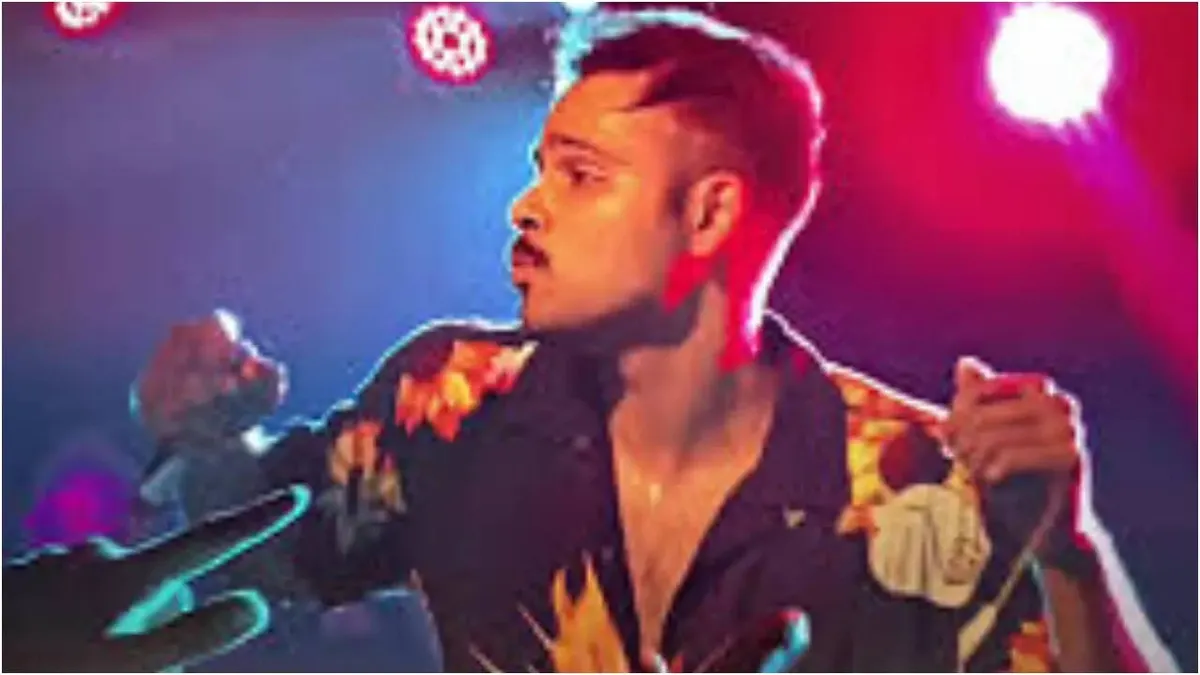 Singer Arpit Bala speaking intently during an interview, dressed casually.