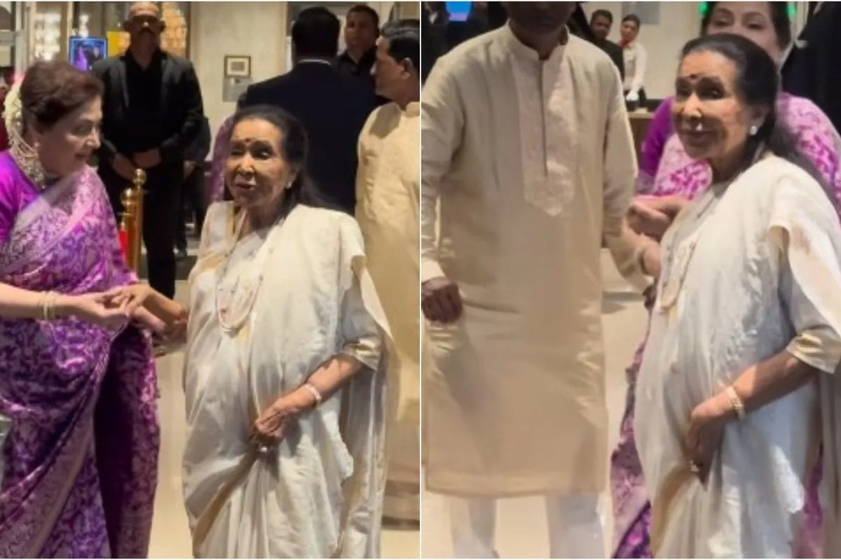 Asha Bhosle in a beautiful outfit, smiling gracefully at a wedding.