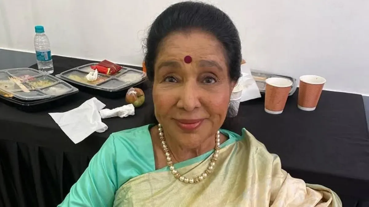 A vintage style portrait of singer Asha Bhosle with a warm aesthetic