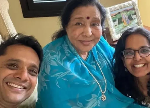 Asha Bhosle performing on stage.