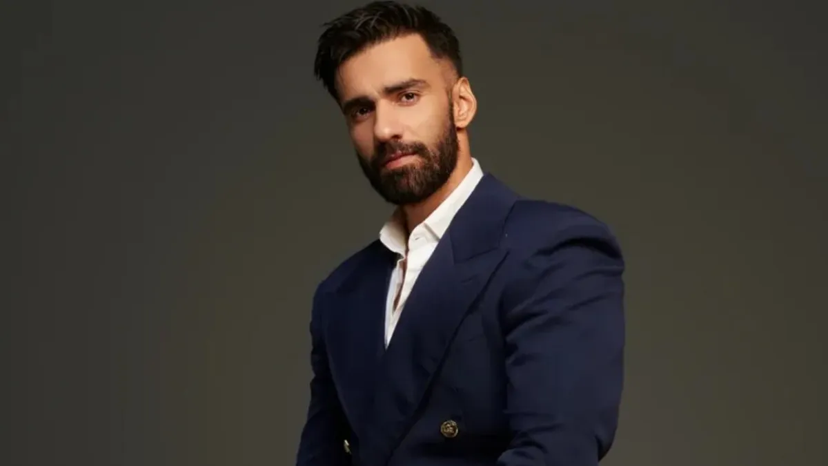 Actor Avinash Tiwary posing for a photo with a thoughtful expression.