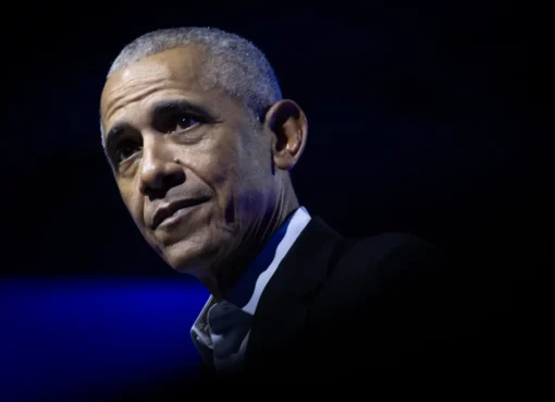 Barack Obama speaking at a podium.
