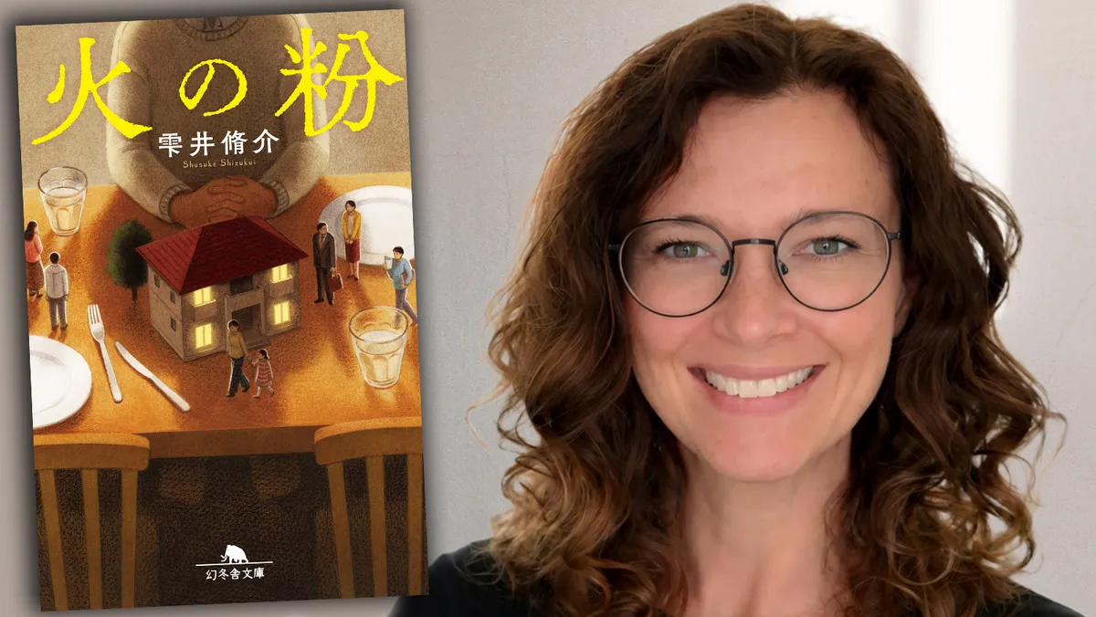 A dark silhouette of a man looking through a window into a brightly lit suburban home.