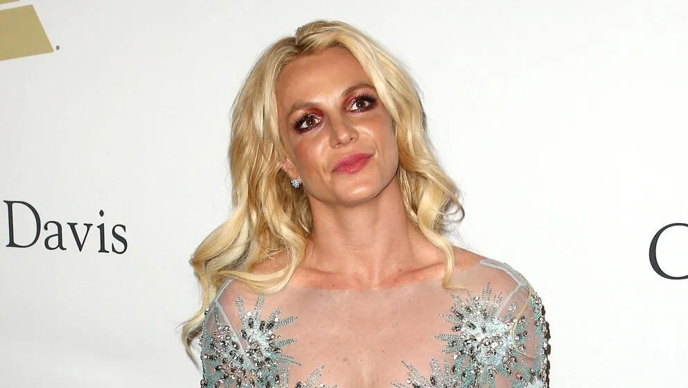 A photo of Britney Spears looking thoughtful during a public appearance.