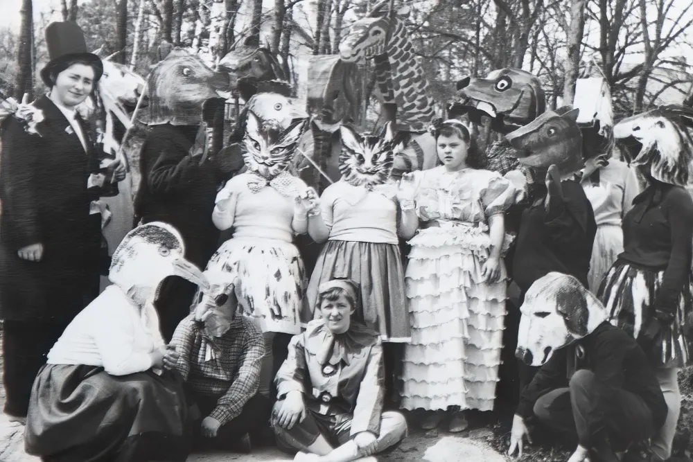 Image of a film festival backdrop with bright lights and a film reel graphic, hinting at the energy of Cannes Docs.