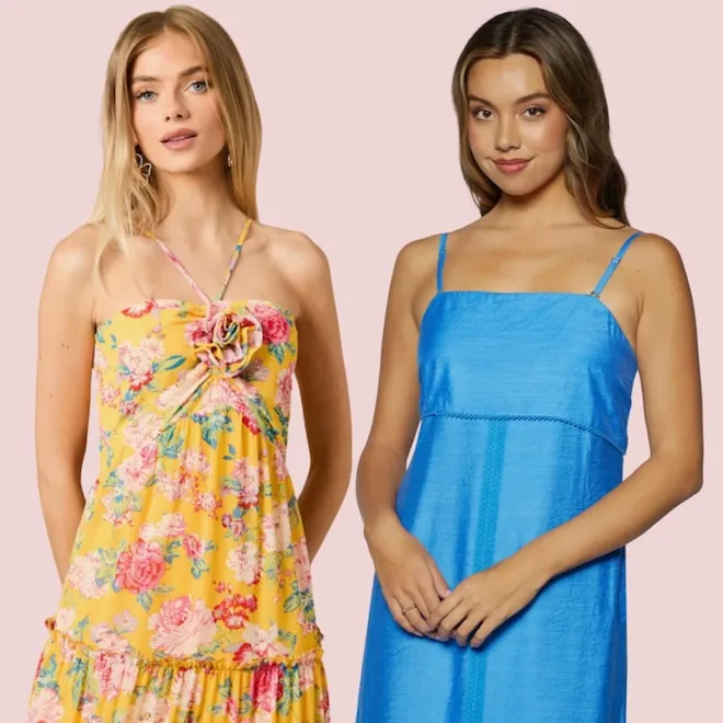 A woman wearing a stylish, flowy, and colorful summer dress suitable for a wedding guest, smiling brightly.