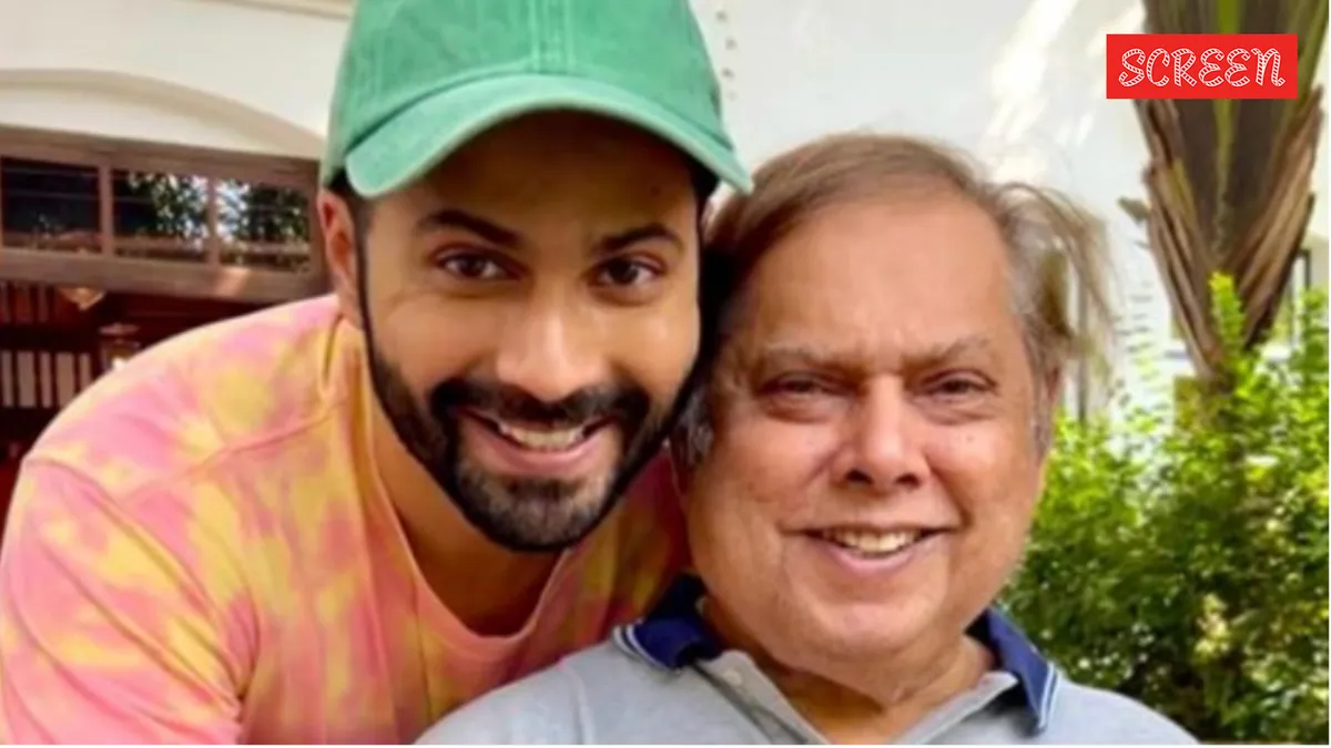David Dhawan and Varun Dhawan smiling together.