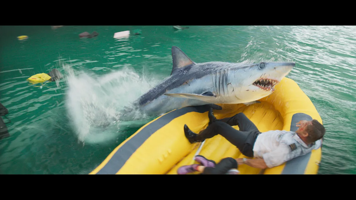 A plane crashing into a shark-infested ocean during a disaster movie.