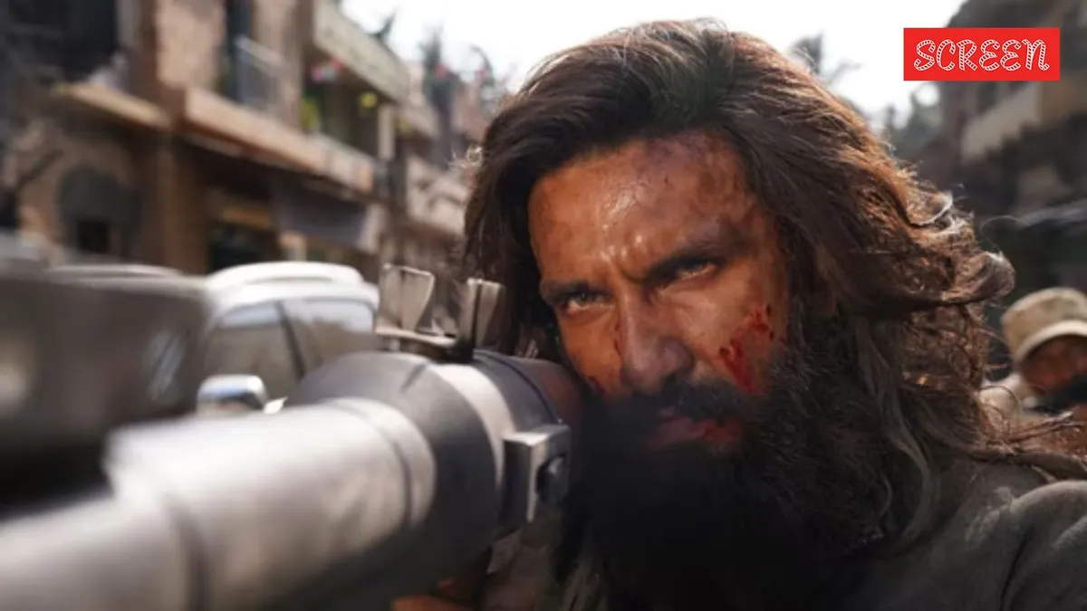 Ranveer Singh looking intense in a scene with gold and red lighting from Dhurandhar 2.