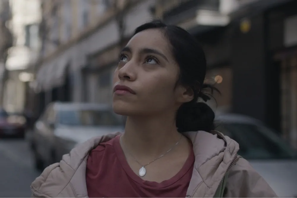 A still image from the movie 'Ashes' showing two young people.