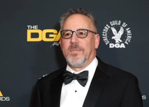 Russell Hollander smiling confidently at an event, looking professional and calm.