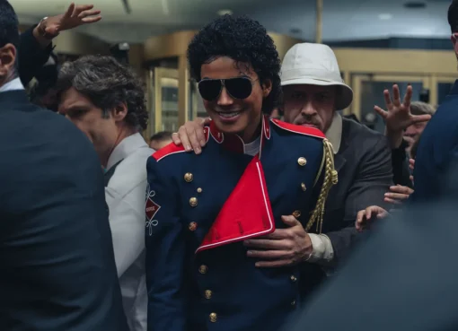 Jaafar Jackson as Michael Jackson, performing on stage with a spotlight.