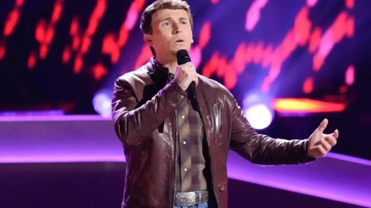 Dylan Carter smiling brightly during a performance.