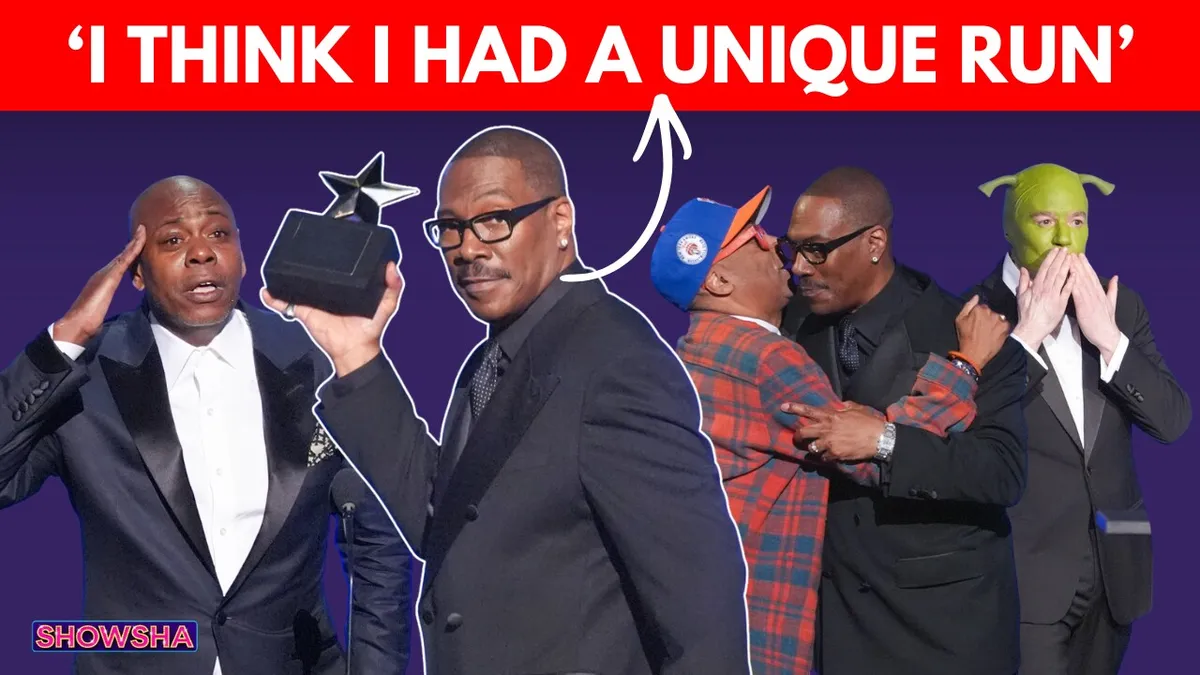 Eddie Murphy on the red carpet, smiling, at the AFI Lifetime Achievement Award ceremony.