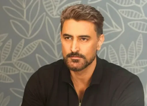 Kunal Kapoor smiling, possibly at a promotional event.