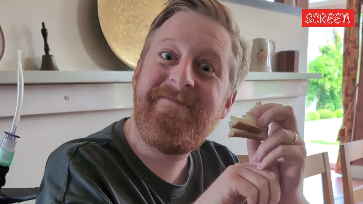 A photo of actor Michael Patrick looking hopeful