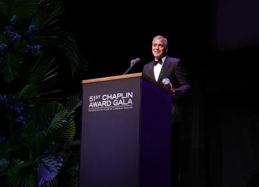 George Clooney smiling at a formal event.