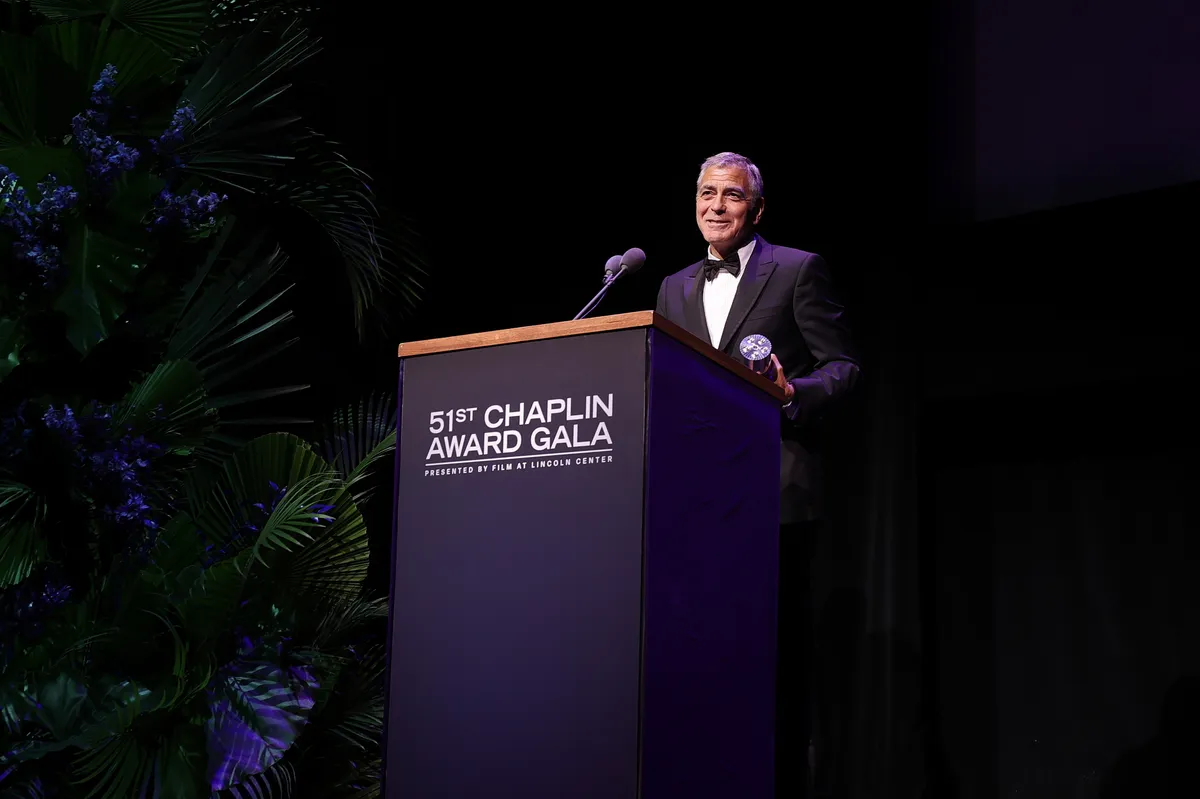 George Clooney smiling at a formal event.