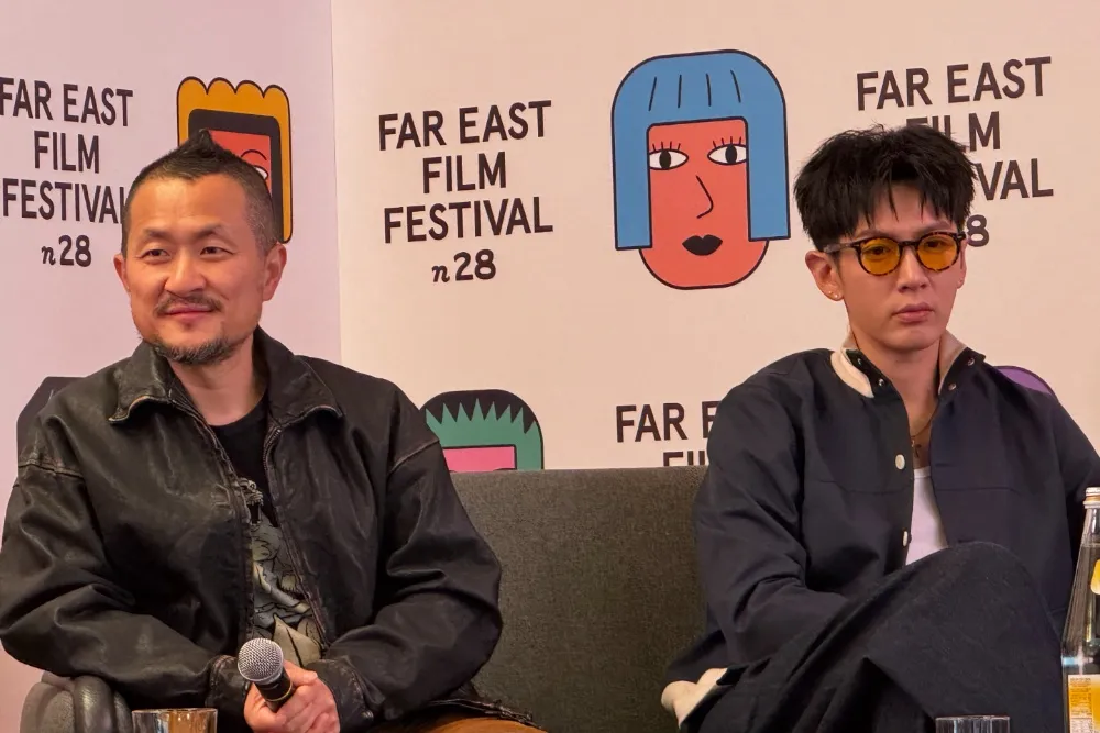 Giddens Ko and Kai Ko smiling at the Far East Film Festival, discussing their new film.