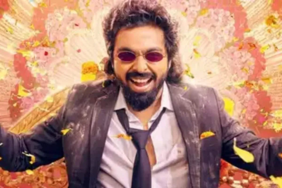 G. V. Prakash Kumar smiling happily in a vibrant movie poster for 'Happy Raj'.