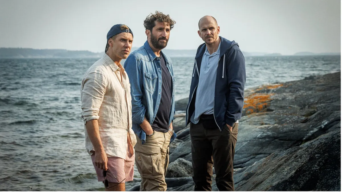 Actors Gustaf Skarsgård, Fares Fares, and Linus Wahlgren in a still from a Scandi drama.