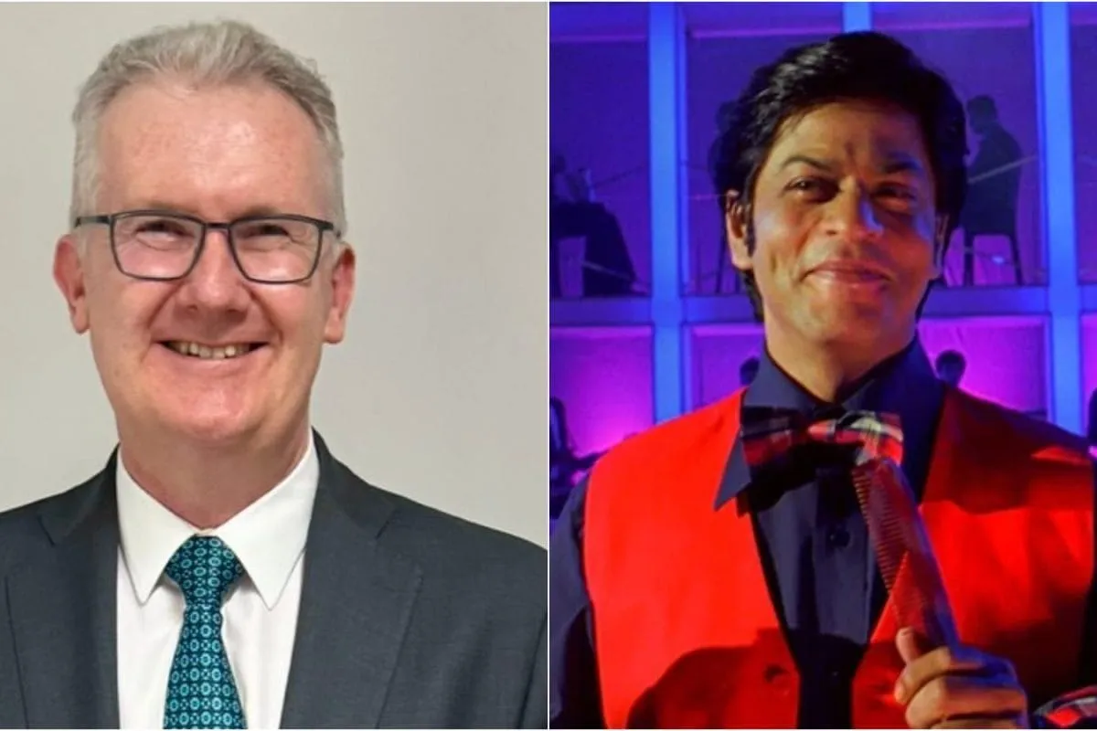 Australian Minister Tony Burke smiling and talking about his love for Shah Rukh Khan movies.