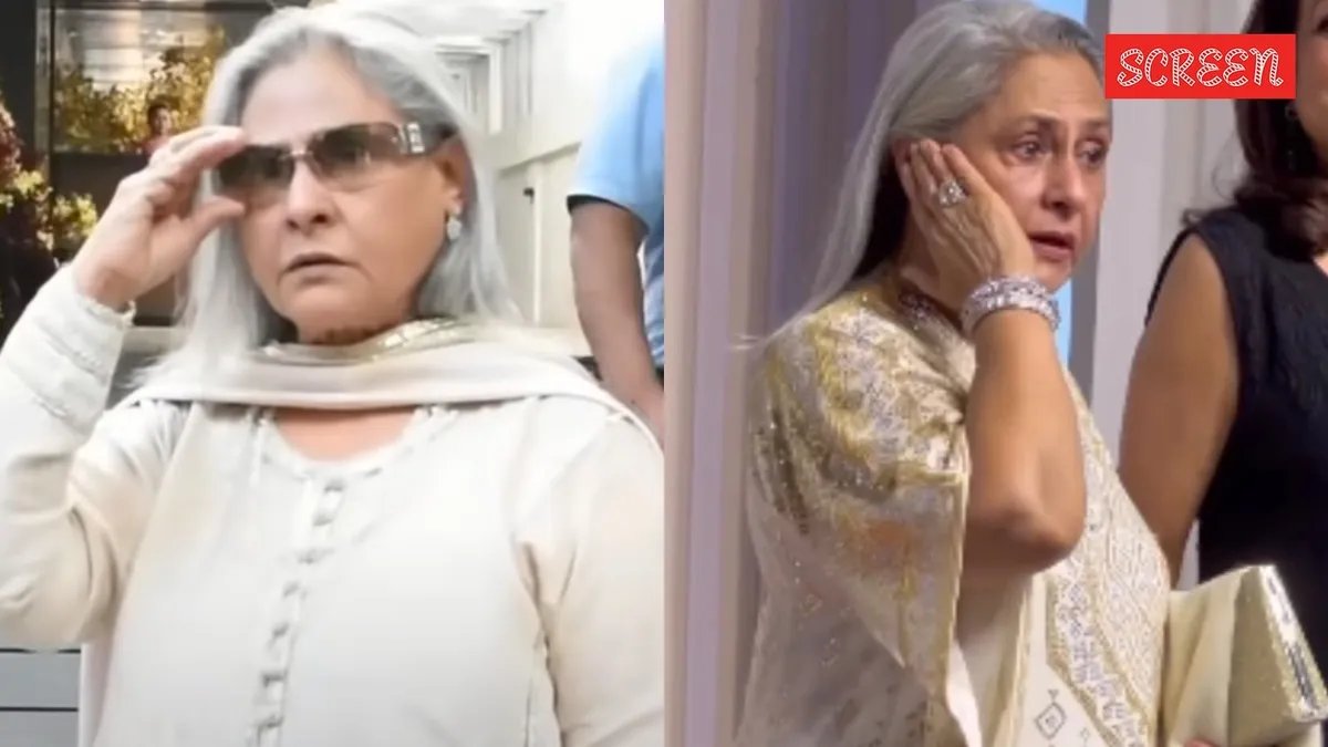Jaya Bachchan looking stern amidst flashing paparazzi cameras