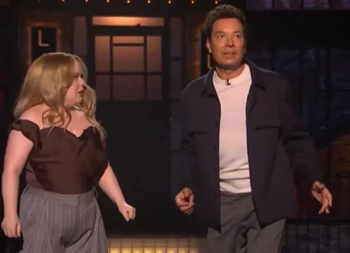 Jimmy Fallon and Nicola Coughlan laughing on the SNL UK stage.