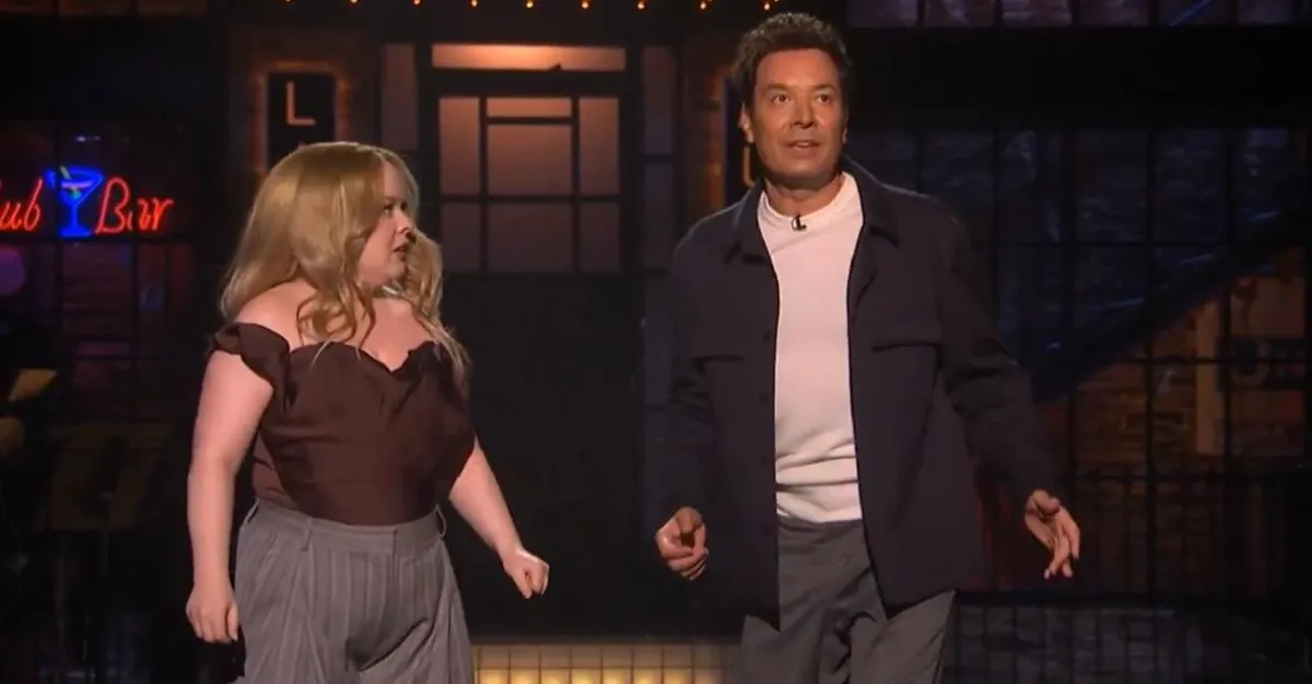 Jimmy Fallon and Nicola Coughlan laughing on the SNL UK stage.