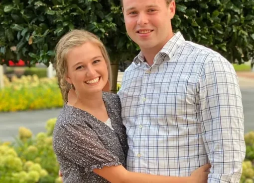 Kendra Duggar looking serious in a formal setting.