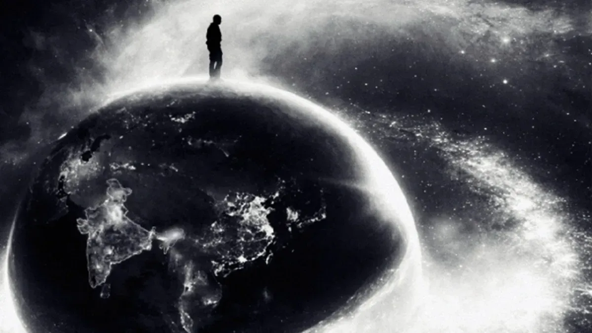 Kanye West (Ye) performing on a stage with dramatic lighting, seen from below.