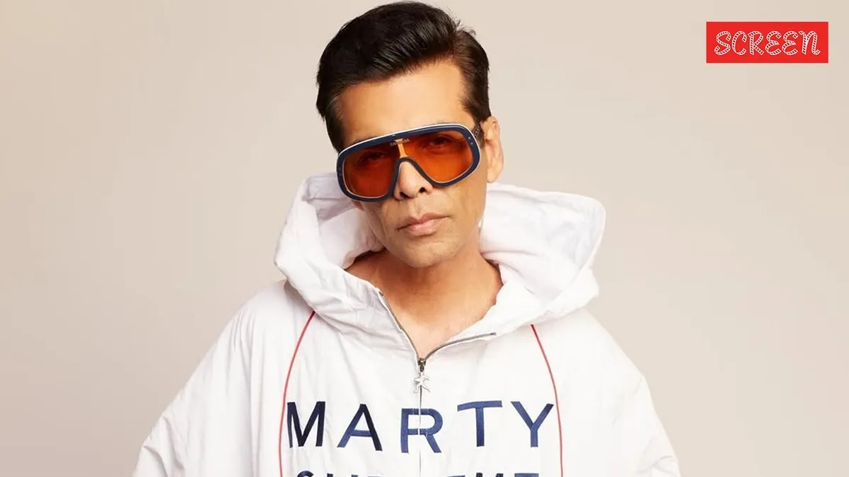 Karan Johar looking thoughtful, perhaps discussing Bollywood PR and the need for authenticity in the film industry.
