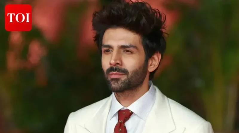 Kartik Aaryan looking directly at the camera in a formal outfit.