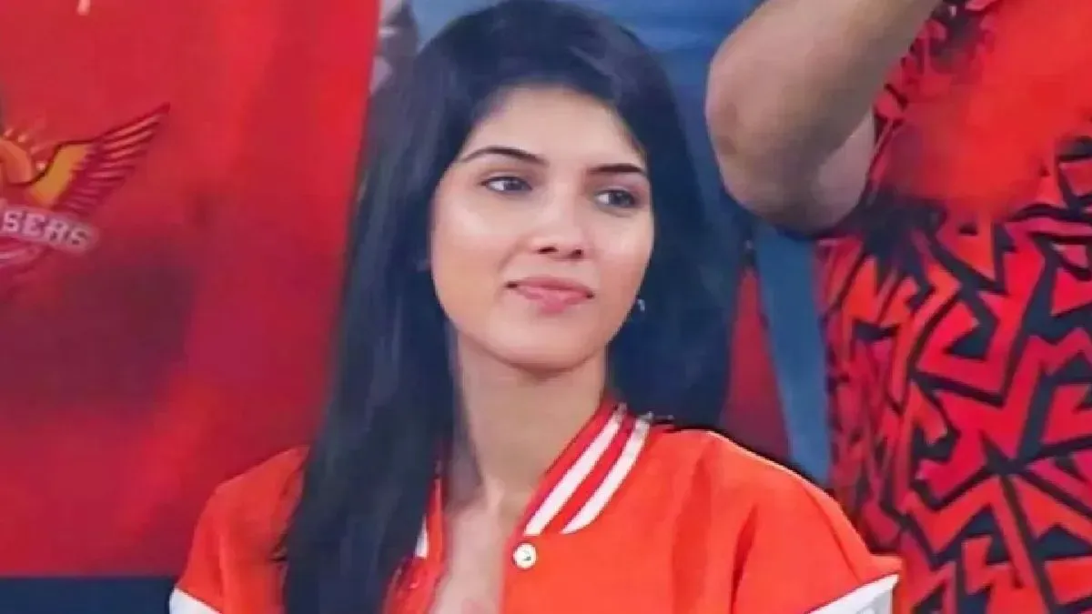 Kavya Maran smiling confidently in a Sunrisers Hyderabad jersey.