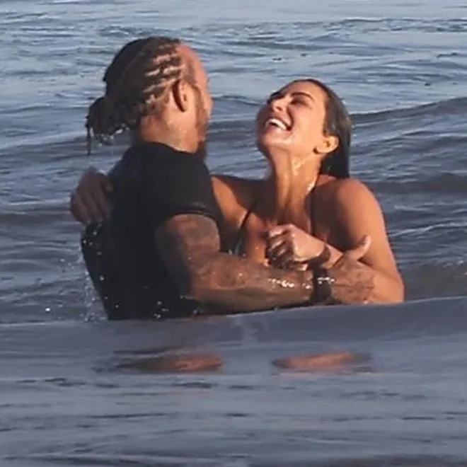 Kim Kardashian and Lewis Hamilton enjoying a sunny day at a Malibu beach.