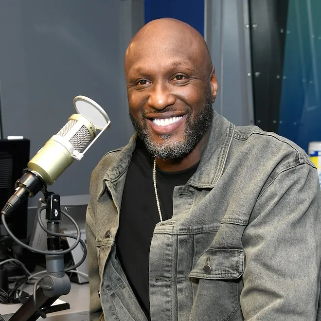 Lamar Odom smiling with a woman