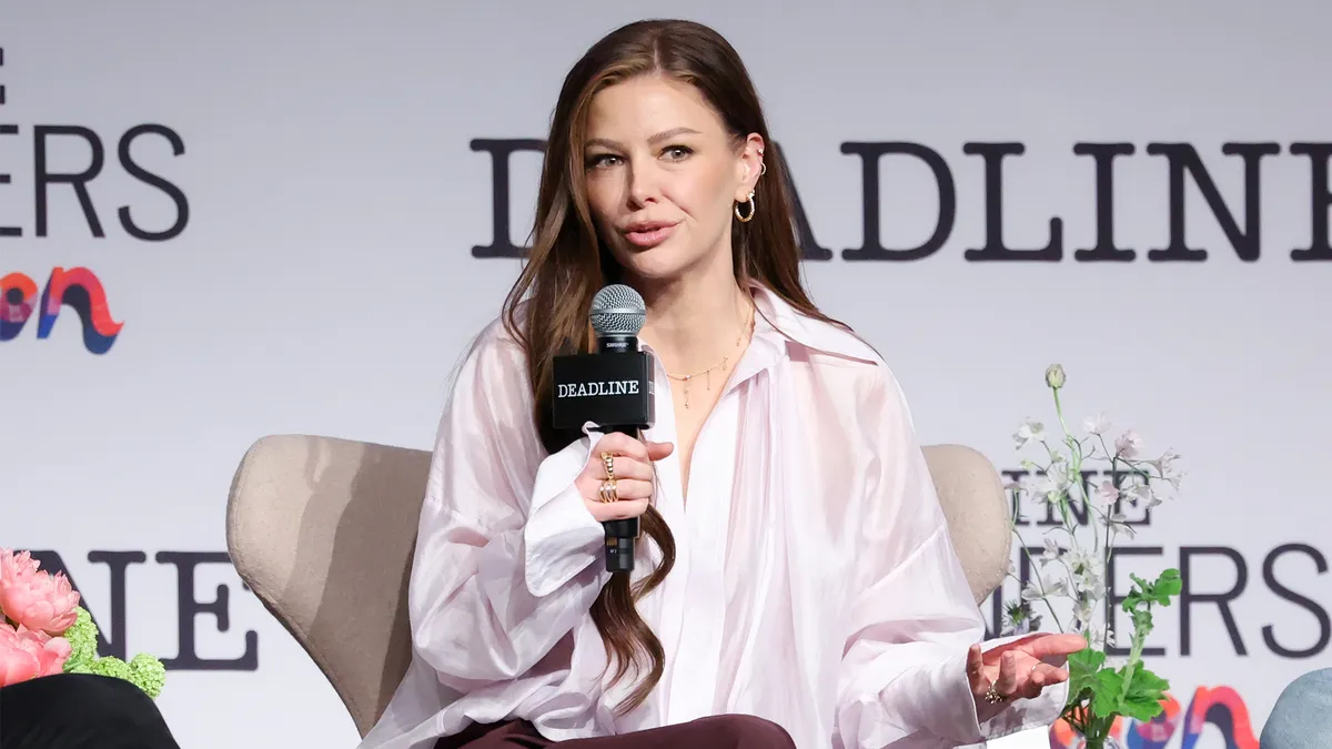 Ariana Madix smiling and looking confident at a public event, possibly Contenders TV.