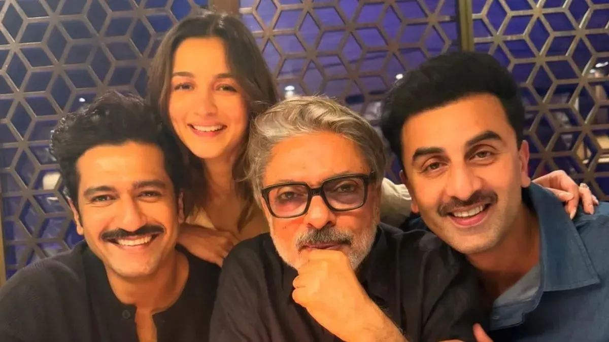 A graphic announcing Sanjay Leela Bhansali's 'Love & War' song shoot with Ranbir Kapoor, Vicky Kaushal, and Alia Bhatt.