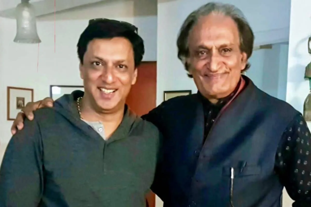 Filmmaker Madhur Bhandarkar in a thoughtful pose, speaking about Raghu Rai.