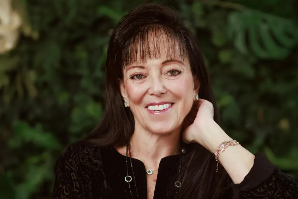 Portrait of Olga Rabinovich smiling warmly.