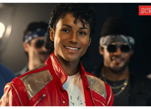 A close-up shot of a young Michael Jackson from the biopic 'Michael,' with dynamic lighting suggesting a performance.