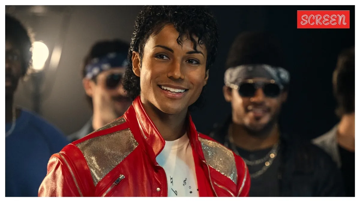 A close-up shot of a young Michael Jackson from the biopic 'Michael,' with dynamic lighting suggesting a performance.